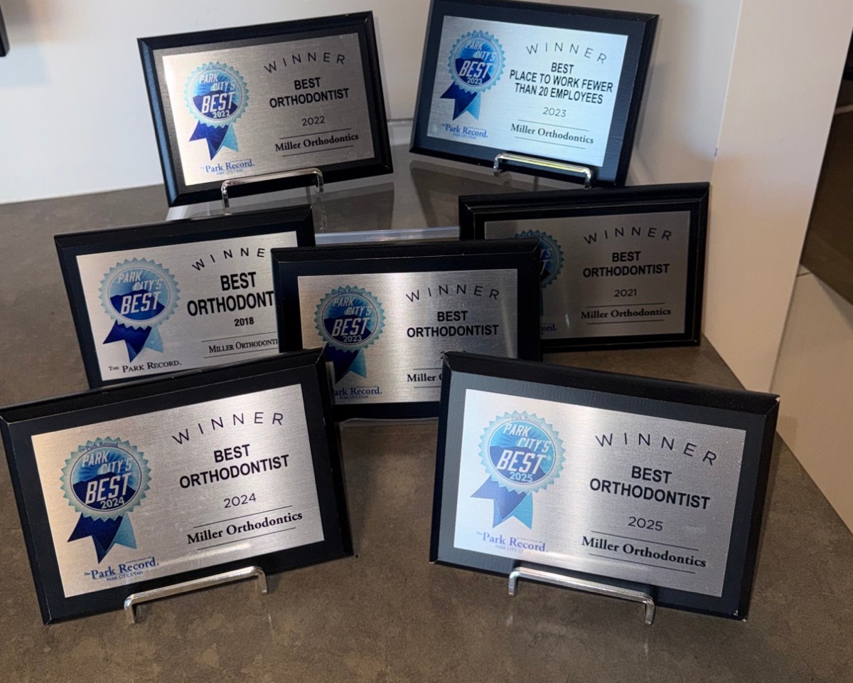 Seven Park City's Best winner plaques for Miller Orthodontics: Best Orthodontist 2018, 2021, 2022, 2023, 2024 and 2025, and Best Place to Work Fewer Than 20 Employees 2023